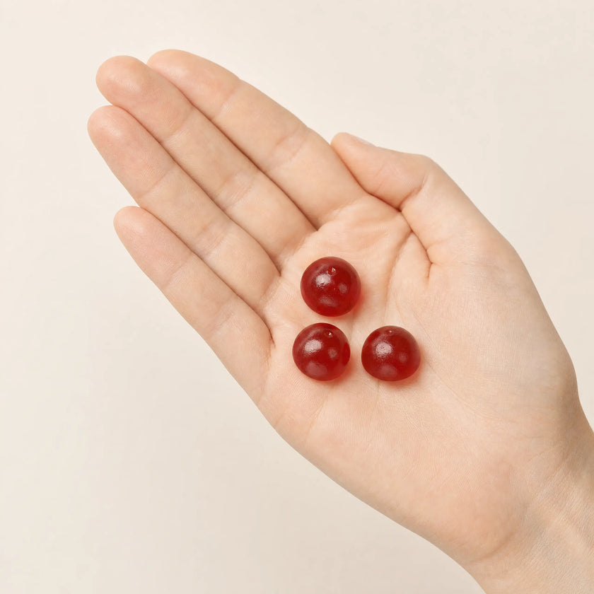 A palm holding individually wrapped gummies