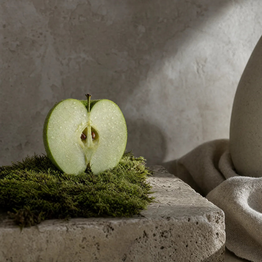 An apple half on moss — the PhytoCellTec™ source